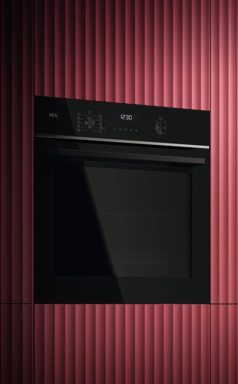 An oven is placed in a kitchen. 